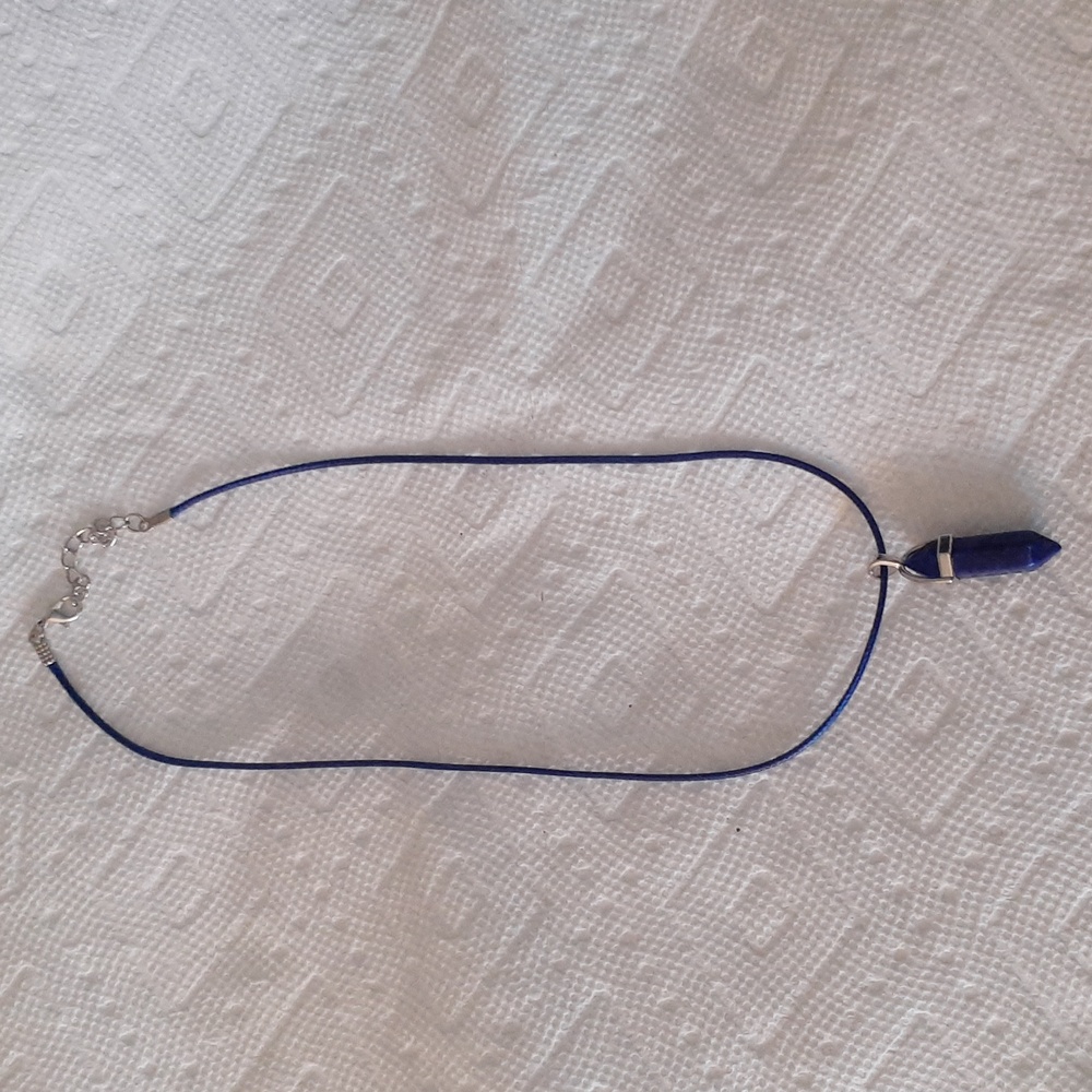 Dark blue bullet pendant.